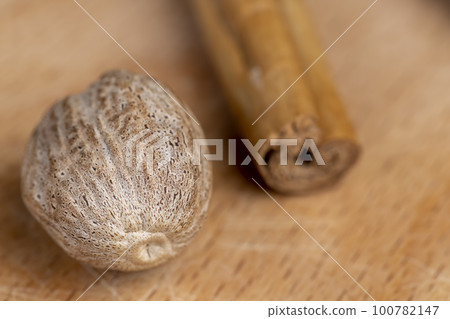 fragrant whole nutmeg in the kitchen 100782147