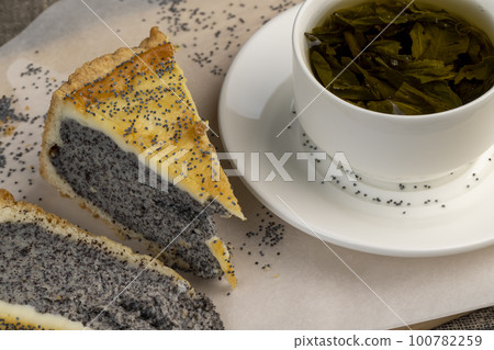 Delicious poppy seed cake with a thin sponge cake and lots of poppy seed filling Delicious poppy seed cake with a thin sponge cake and lots of poppy seed filling 100782259