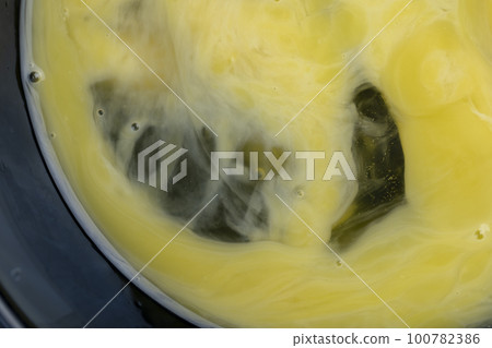 Homemade chicken eggs with yellow yolk broken in a bowl Homemade chicken eggs with yellow yolk broken in a bowl 100782386