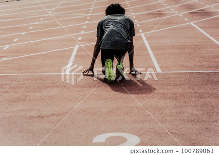 Runner track and field start Runner track and field start 100789061