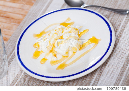 Catalan cheese mato from goat milk with honey 100789486