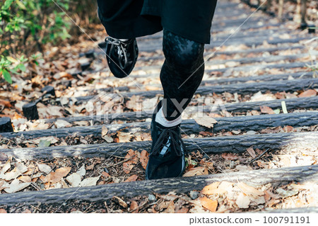 Athlete running stairs foot 100791191