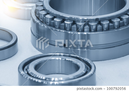 The cylindrical rolling bearing parts in light blue scene. The cylindrical rolling bearing parts in light blue scene. 100792056