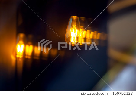 lamp in the window of a cafe showcase. details of the decorative interior of the building lamp in the window of a cafe showcase. details of the decorative interior of the building 100792128