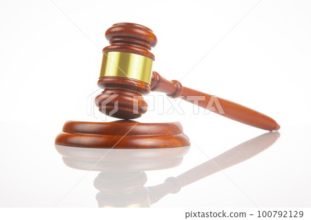 wooden hammer for auctions, bidding and judicial law. symbol of justice and verdict wooden hammer for auctions, bidding and judicial law. symbol of justice and verdict 100792129