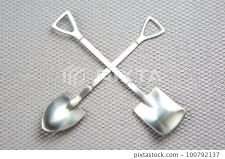 decorative fork and spoons in the form of spades on a gray background. food tools. 100792137