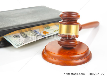 gavel of justice on the background of dollars. corruption in law. buying a judgment gavel of justice on the background of dollars. corruption in law. buying a judgment 100792177