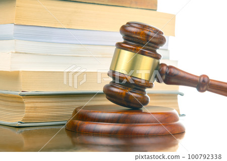 judicial gavel on the background of law books. justice and fairness judicial gavel on the background of law books. justice and fairness 100792338