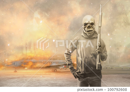 Man wearing a mask holding a gun Man wearing a mask holding a gun 100792608