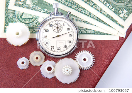 mechanical stopwatch on the background of dollars. Part time accuracy for business. 100793067