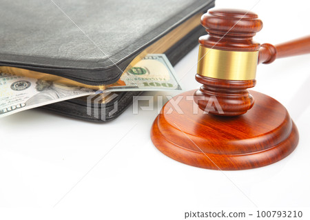 gavel of justice on the background of dollars. corruption in law. buying a judgment 100793210