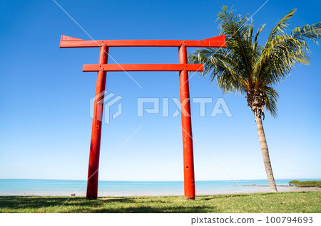 Torii and blue sky standing on the beach in Bloom Torii and blue sky standing on the beach in Bloom 100794693