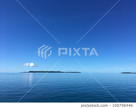 Pristine blue ocean, rock islands in Palau 100798446