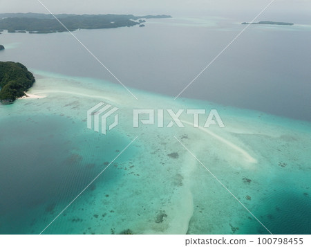 Pristine blue ocean, rock islands in Palau 100798455