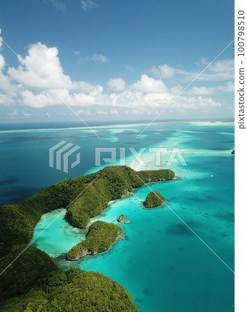 Pristine blue ocean, rock islands in Palau 100798510