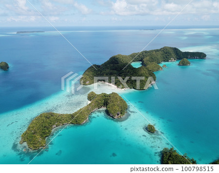 Pristine blue ocean, rock islands in Palau 100798515