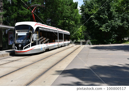 Streetcar in the middle of a green park in Moscow, Russia 100800517