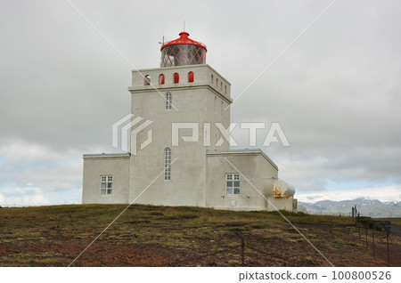 Lighthouse of Dyrholaey formerly known as Cape Portland on the south coast of Iceland Lighthouse of Dyrholaey formerly known as Cape Portland on the south coast of Iceland 100800526