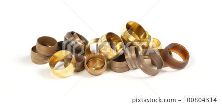 Close up metal and plastic press sleeves 100804314