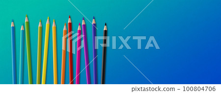Colored pencil group isolated on blue. Panoramic banner background Colored pencil group isolated on blue. Panoramic banner background 100804706