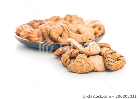 Assorted various cookies. Sweet biscuits isolated on white background. 100805031
