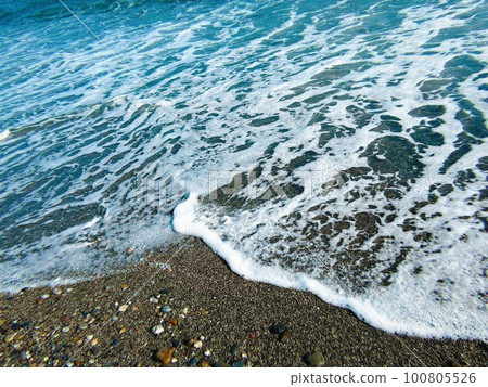 Foam on the beach, the crystal clear sea Foam on the beach, the crystal clear sea 100805526