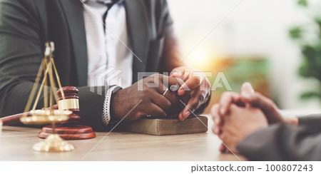 American African Lawyers advice to client about agreement contract. Law, legal services, advice, Justice concept American African Lawyers advice to client about agreement contract. Law, legal services, advice, Justice concept 100807243