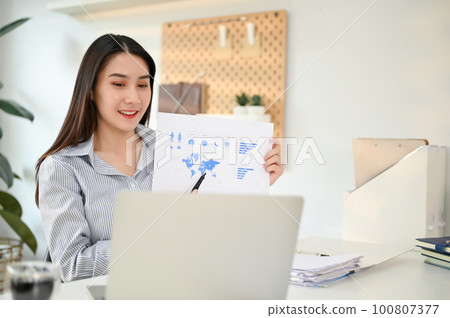 Charming Asian businesswoman having an online meeting with her marketing team Charming Asian businesswoman having an online meeting with her marketing team 100807377