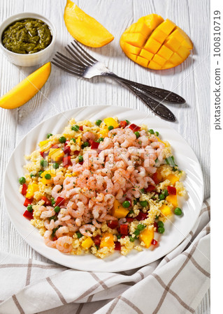 shrimps and millet pilaf with mango and veggies shrimps and millet pilaf with mango and veggies 100810719