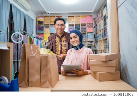 muslim business owner packing product for delivery muslim business owner packing product for delivery 100811002