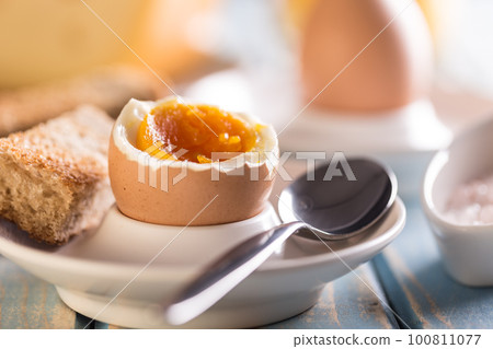 Boiled egg in eggcup 100811077