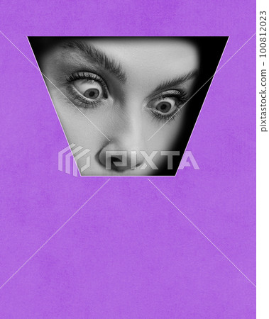 Shocked face. Black and white female face part with widely open eyes against purple background. Contemporary art collage. Conceptual design. Shocked face. Black and white female face part with widely open eyes against purple background. Contemporary art collage. Conceptual design. 100812023