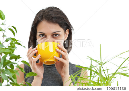 Woman drinking tea 100815186
