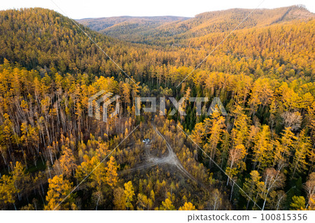Car camping in autumn forest. Drone wiev Car camping in autumn forest. Drone wiev 100815356