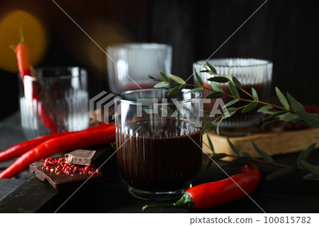 Concept of delicious food - chocolate with pepper and hot chocolate with pepper Concept of delicious food - chocolate with pepper and hot chocolate with pepper 100815782