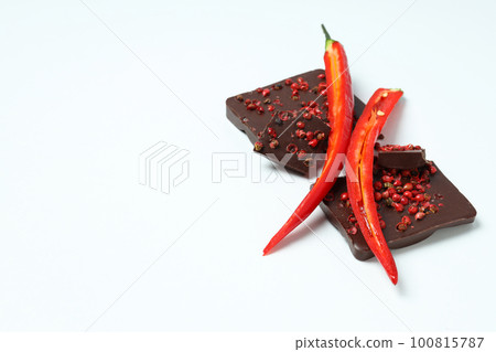 Concept of delicious food - chocolate with pepper Concept of delicious food - chocolate with pepper 100815787