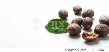 Concept of spices and condiments, nutmegs, space for text Concept of spices and condiments, nutmegs, space for text 100815870