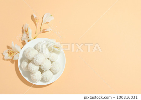 Concept of tasty sweets, coconut candies, space for text Concept of tasty sweets, coconut candies, space for text 100816031