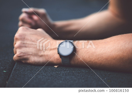 Close up unrecognizable man wearing smart watch on the wrist Close up unrecognizable man wearing smart watch on the wrist 100816150