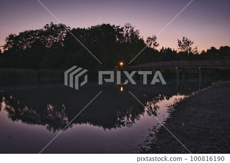 Mangfallsteg bridge with the reflection in river at dusk near Gmund am Tegernsee, Bavaria, Germany Mangfallsteg bridge with the reflection in river at dusk near Gmund am Tegernsee, Bavaria, Germany 100816190