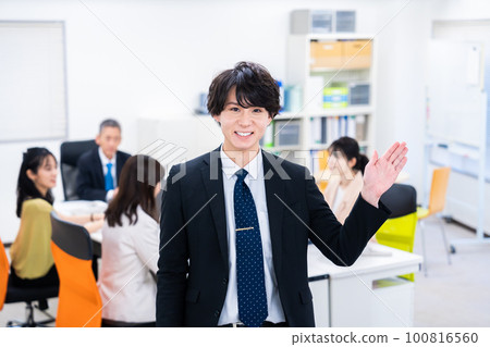 Businessman pointing finger in the office 100816560