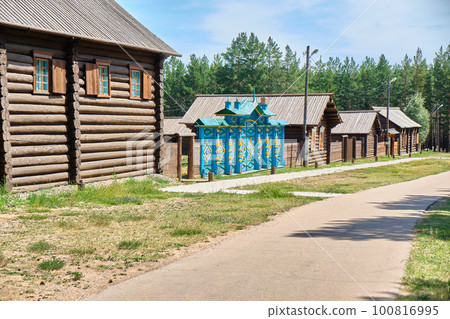 Street of the Old Believer settlement with houses of the late 19th century in the Ethnographic Museum of the Peoples of Transbaikalia. Ulan-Ude, Republic of Buryatia, Russia. 100816995