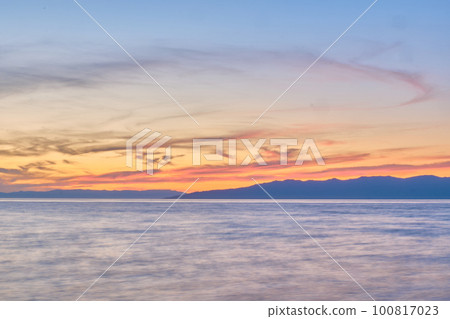 Sunset on Lake Baikal in the Barguzin Bay. Republic of Buryatia, Maksimikha settlement. Sunset on Lake Baikal in the Barguzin Bay. Republic of Buryatia, Maksimikha settlement. 100817023