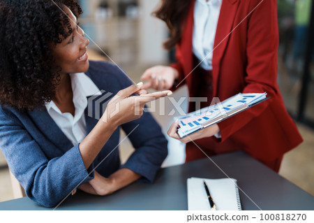 Multiethnic business, Beautiful American African with asian businesswomans people in meeting. Accountant people do document, tax, exchange, accounting and Financial advisor. 100818270