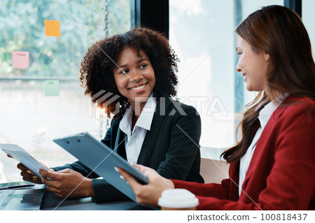 Multiethnic business, Beautiful American African with asian businesswomans people in meeting. Accountant people do document, tax, exchange, accounting and Financial advisor. Multiethnic business, Beautiful American African with asian businesswomans people in meeting. Accountant people do document, tax, exchange, accounting and Financial advisor. 100818437