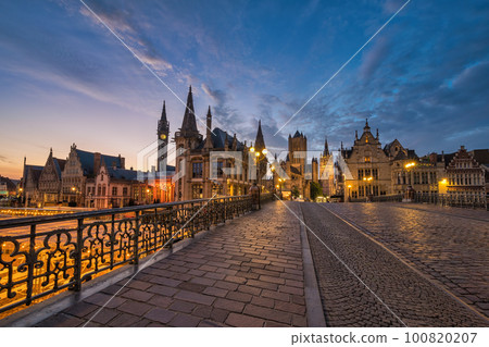 Ghent Belgium, city skyline night at St Michael's Bridge (Sint-Michielsbrug) with Leie River and Korenlei 100820207