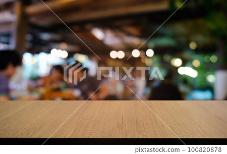 Empty dark wooden table in front of abstract blurred bokeh background of restaurant . can be used for display or montage your products.Mock up for space. 100820878