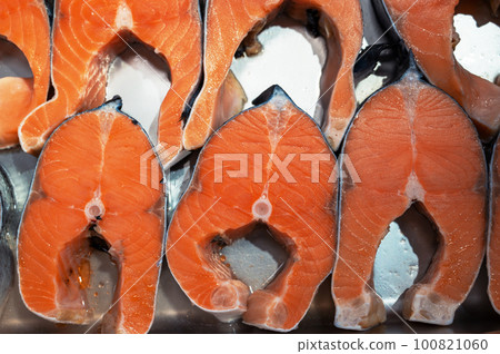 Salmon steaks fish closeup in a market Salmon steaks fish closeup in a market 100821060