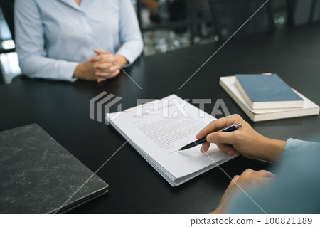 Business woman sending resignation letter to boss and Holding Stuff Resign Depress or carrying cardboard box by desk in office 100821189