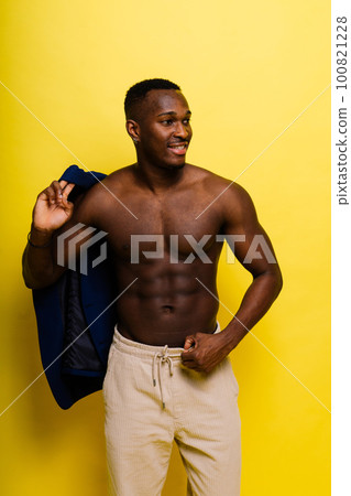 African black man model in blue suit topless, studio background 100821228